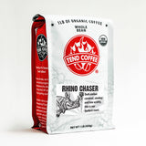 White one pound coffee bag with the USDA Organic logo, the Tend Coffee Logo, weight of one pound, a black and white line drawn front of a Rhinoceros with the roast level being a number 5 out of 5.  The description of the coffee reads dark amber caramel, smokey and low acidity.  This is our darkest roast.  One side of the bag is partly showing.