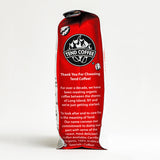 Red coffee bag with Tend Coffee branding on a white background